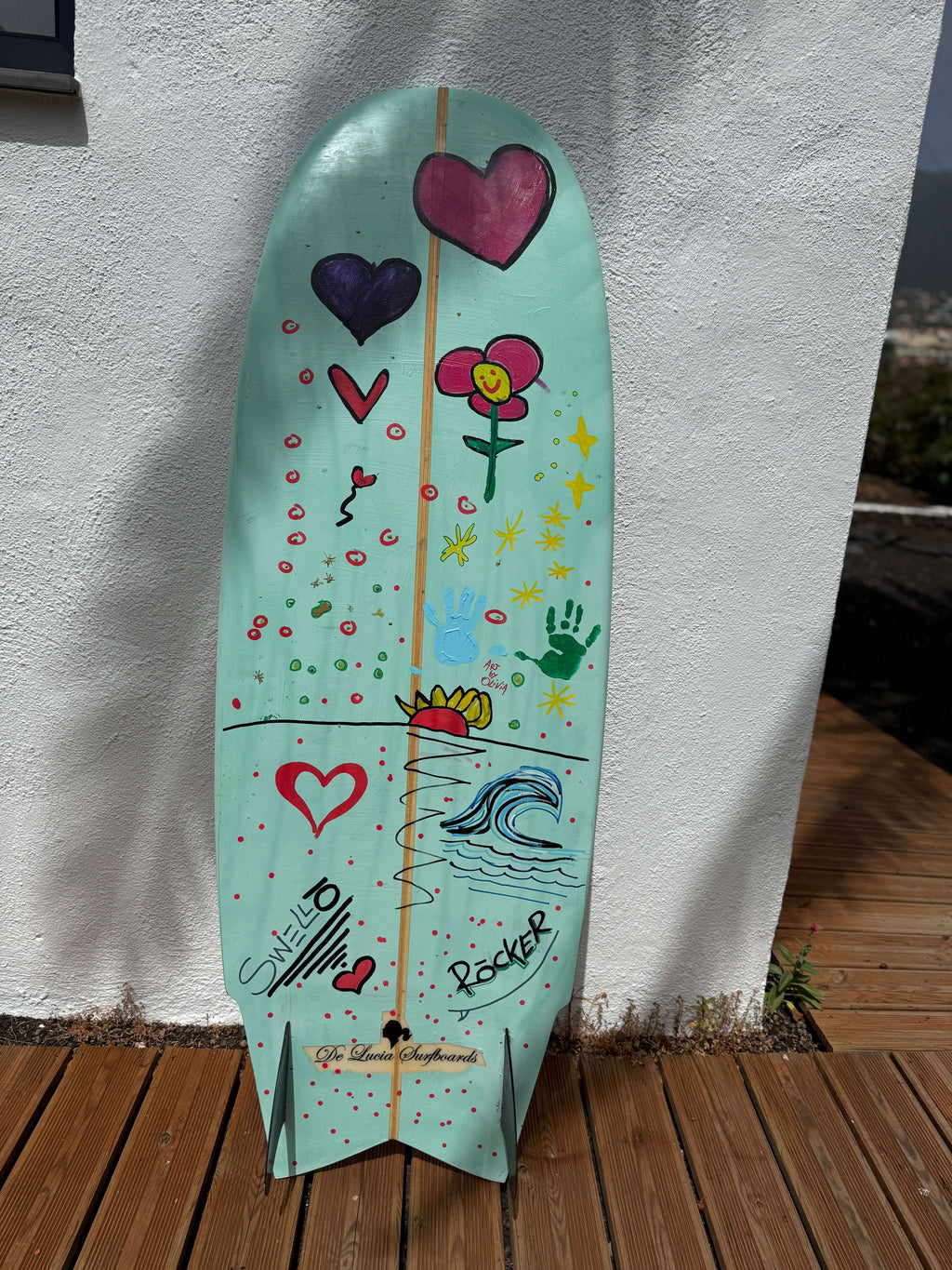 OG Wenzel MiniSimmons Surfboard by SWELLŌ, hand-painted surfboard with colorful designs.