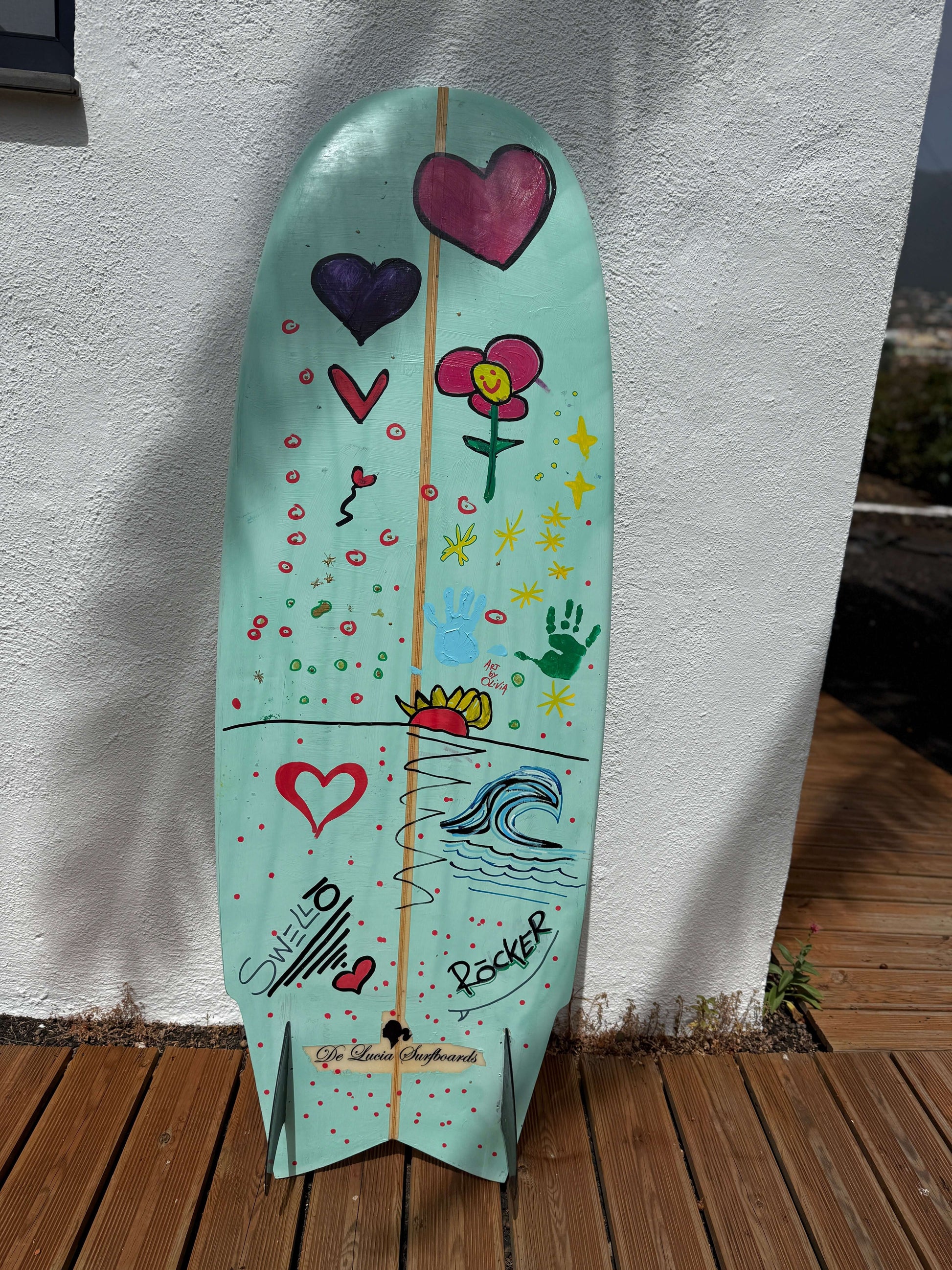 OG Wenzel MiniSimmons Surfboard by SWELLŌ, hand-painted surfboard with colorful designs.